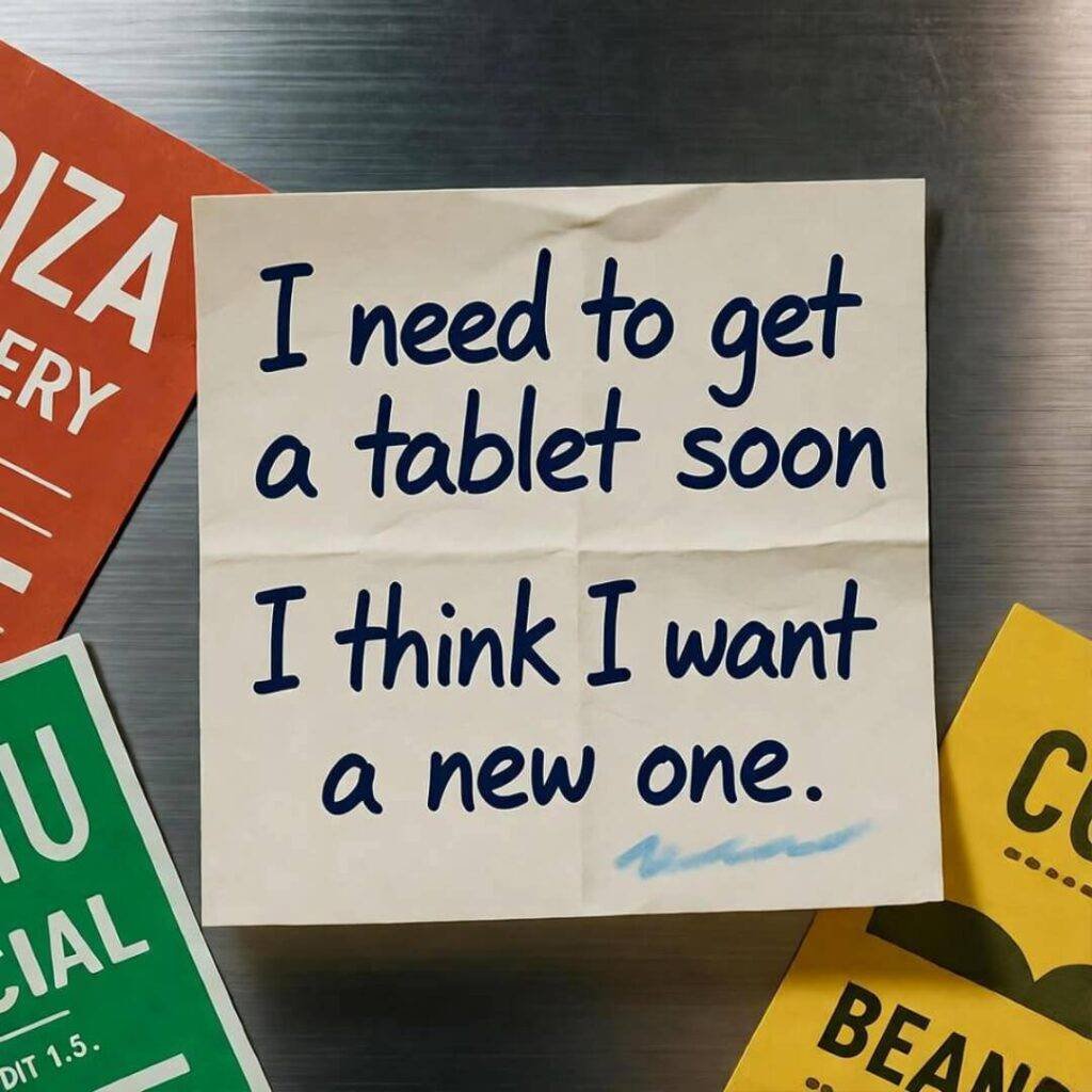 Creased sticky note on fridge: "Need tablet soon, want new one." Red and green menus around.